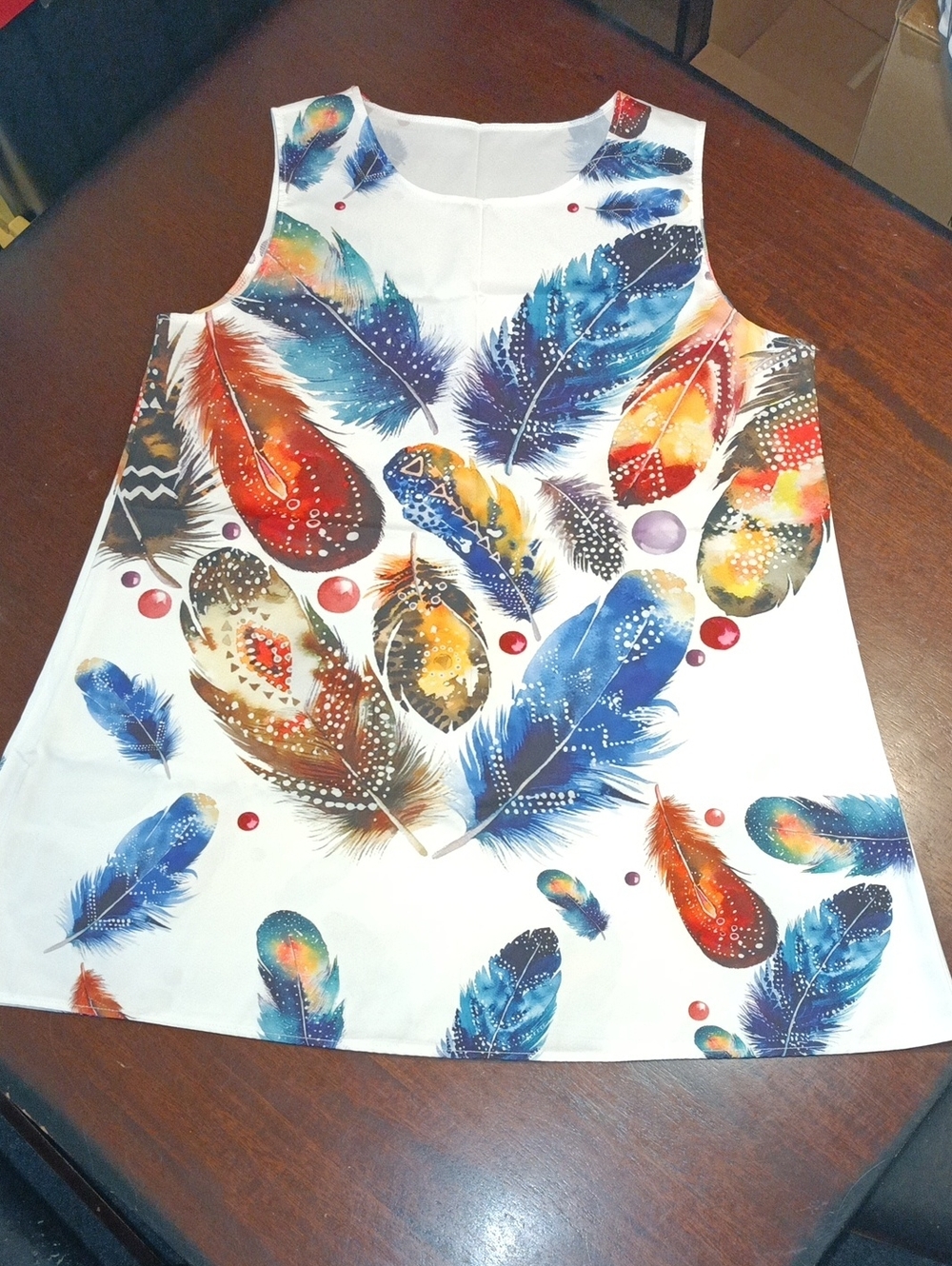 White Sleeveless Top with Colorful Feather Print
